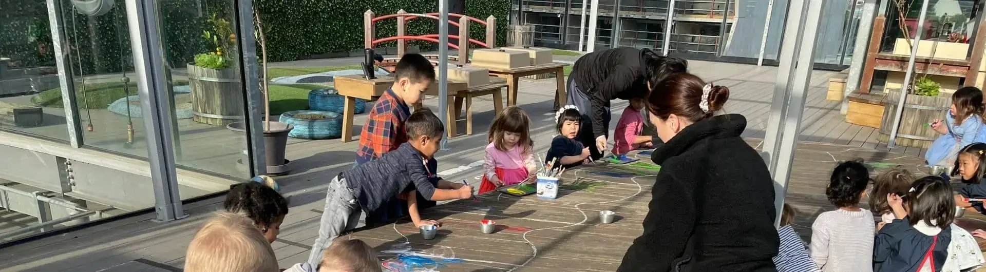 Children at preschool painting together