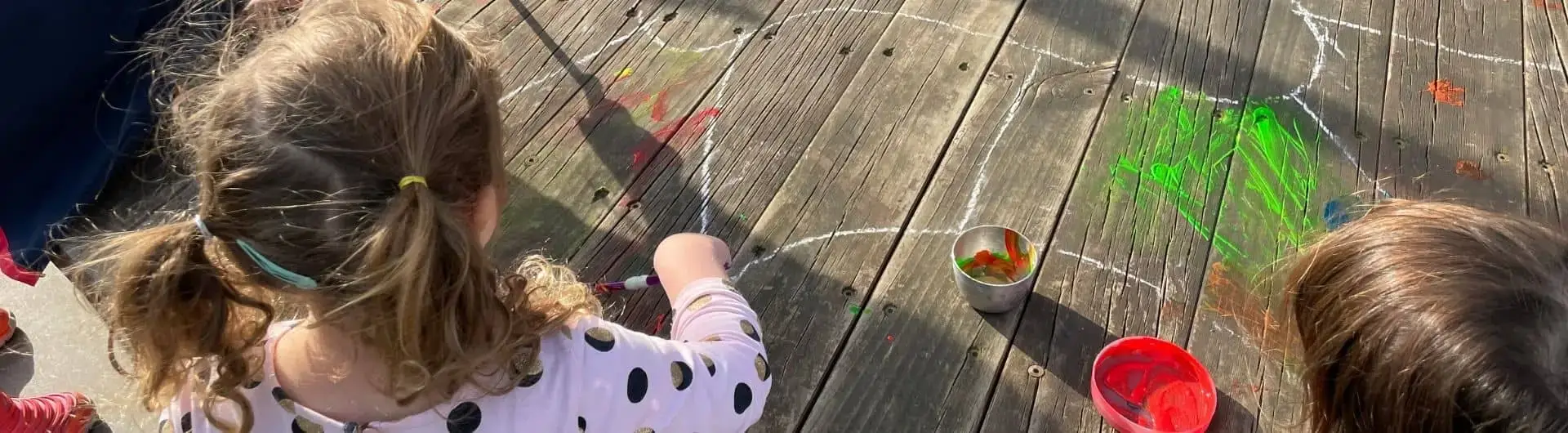 Kindgarten Children drawing with chalk